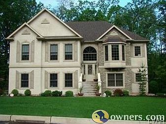 Elegant Stone & Stucco Facade, Copper Roofing, Marvin Windows