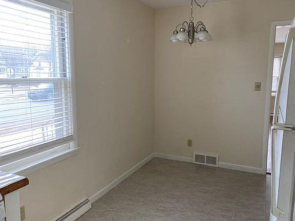 Dinette area of the kitchen. Easy-clean vinyl floor.