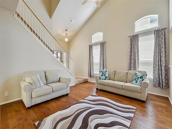 Lovely vaulted living room with wood floors and great light.