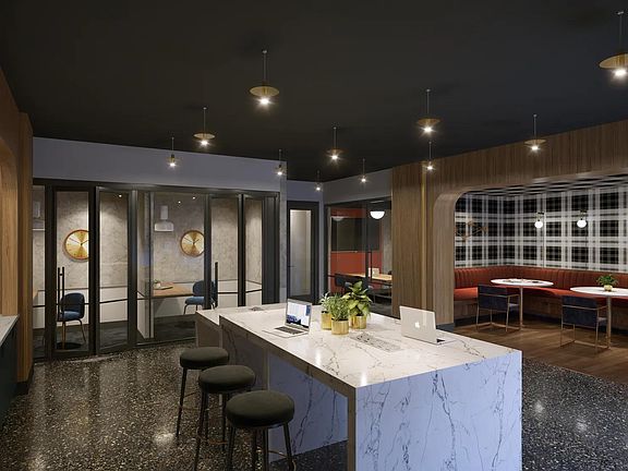 Coworking space with private workstations, comfortable seating areas, and complimentary high-speed Wi-Fi.