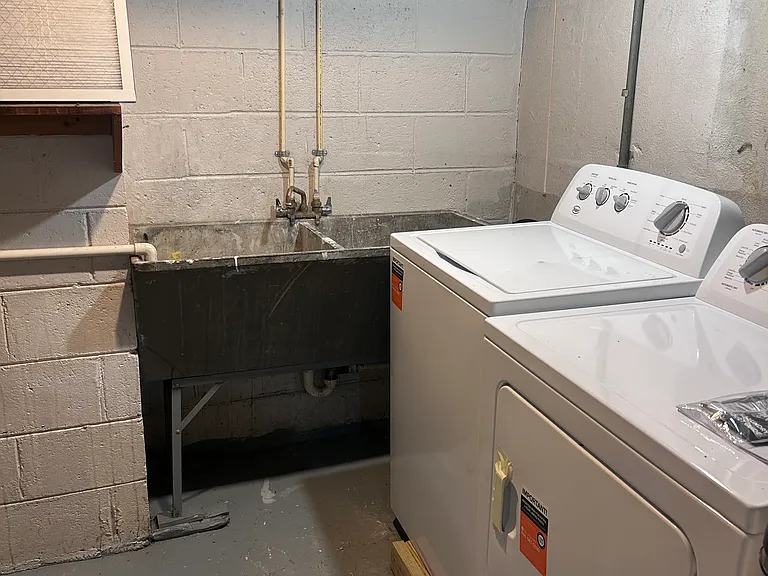 Laundry room is in its own room in finished lower level. FREE to use.