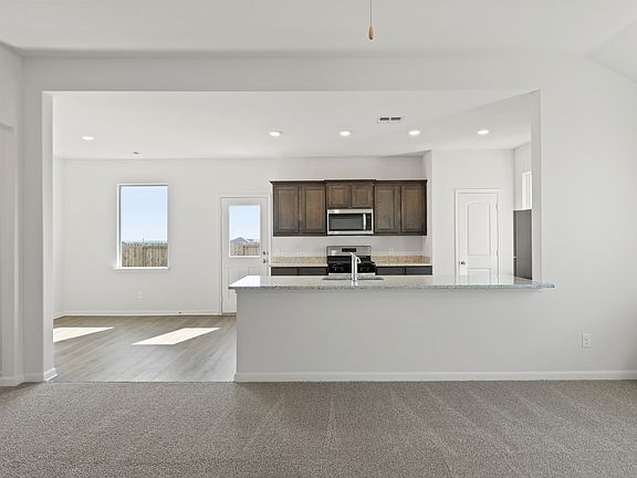 The dining room sits adjacent to the kitchen.