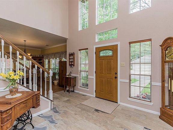 The spacious two-story entry has been updated with a slate-look tile.