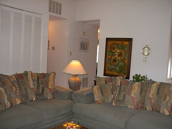 living room has large louvered closets