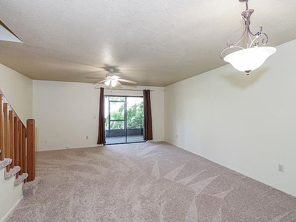 Spacious living/dining room with brand new carpet!