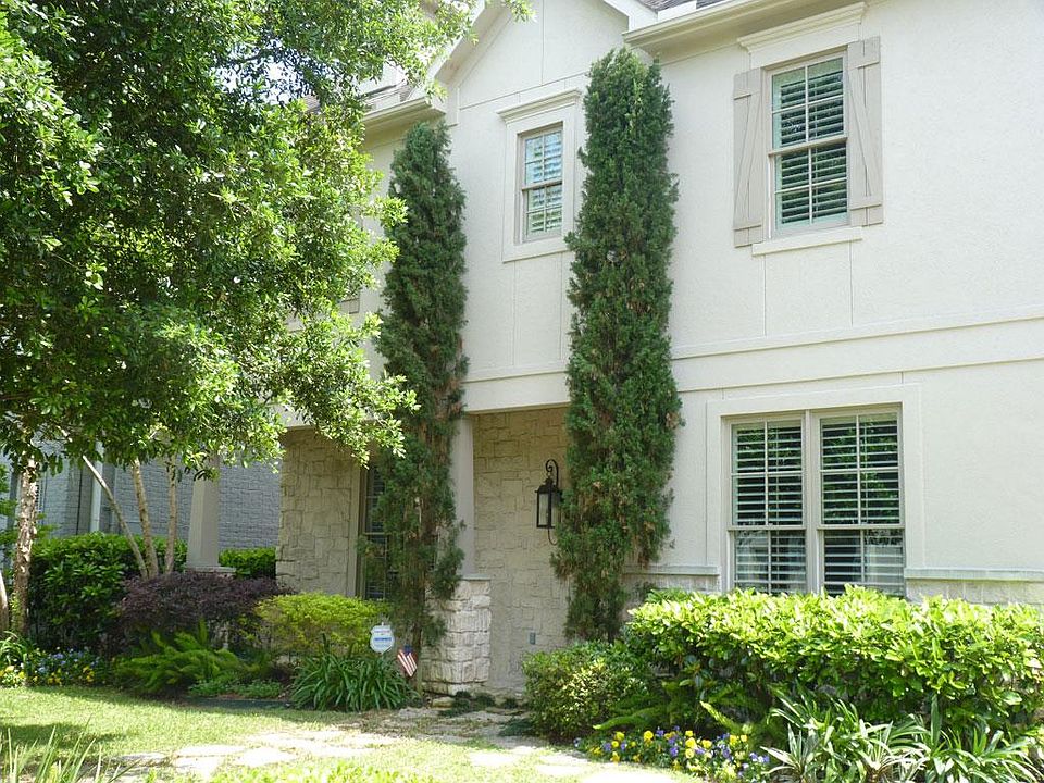 The beautiful stucco and stone home with quarters in located in the heart of West University.
