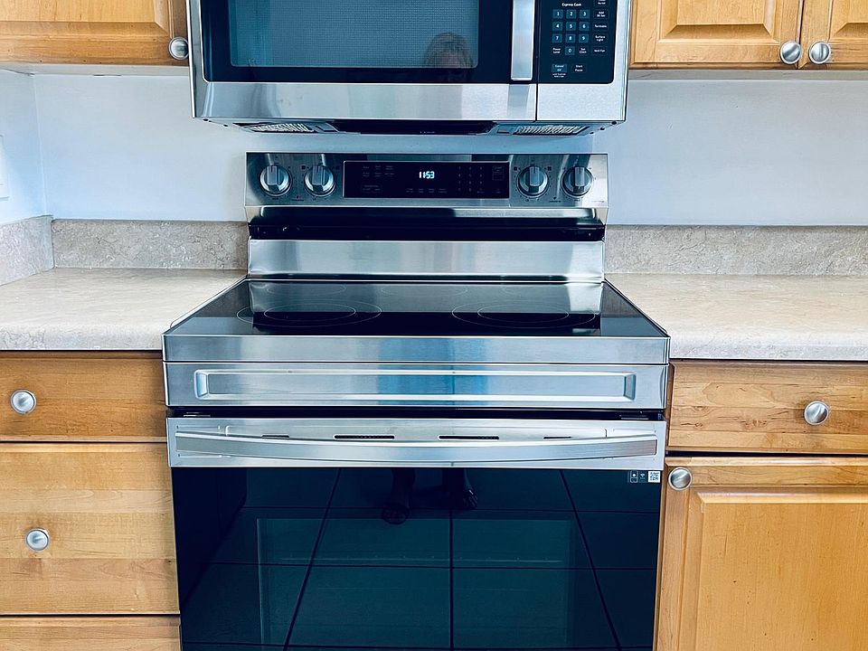 NEW STAINLESS STEEL STOVE AND MICROWAVE