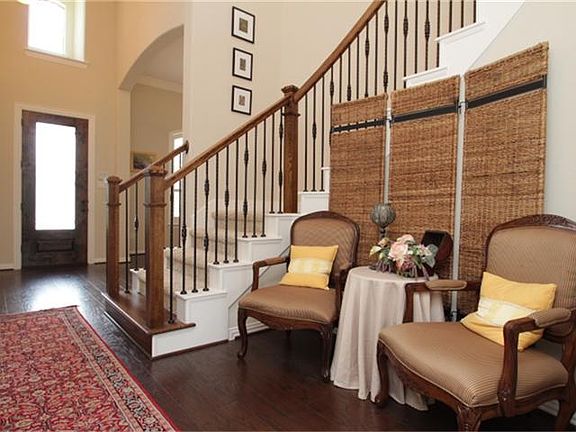 Entrance alcove with beautiful staircase.