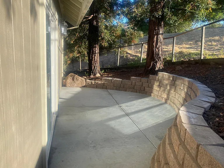 Back patio adjacent to open space