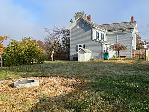 Fenced back yard with firepit