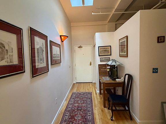 Penthouse level living allows natural light from skylights over the entry-way.