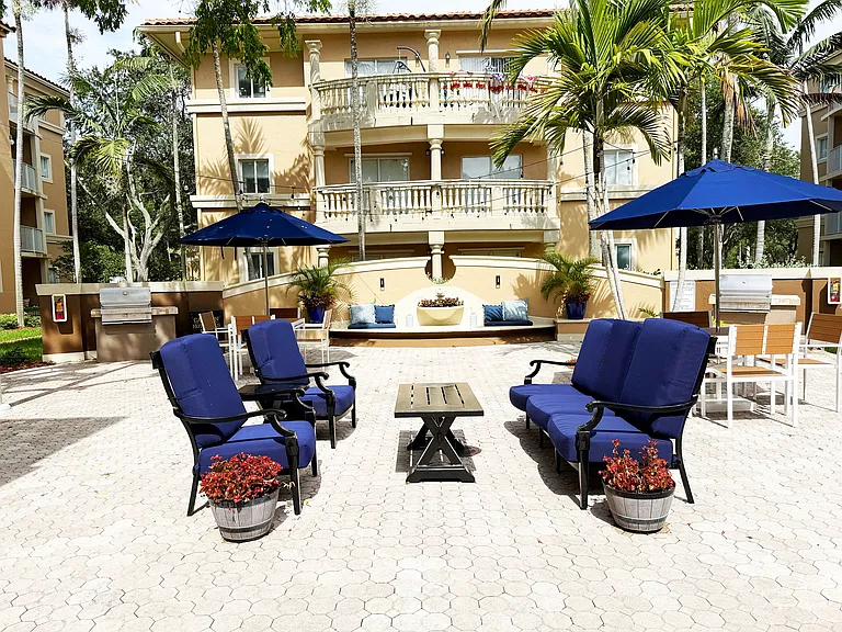 Outdoor Patio with Picnic Tables and BBQ