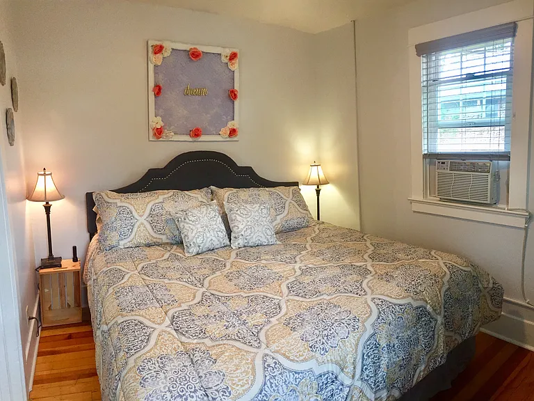 Bedroom with king size bed and window A/C
