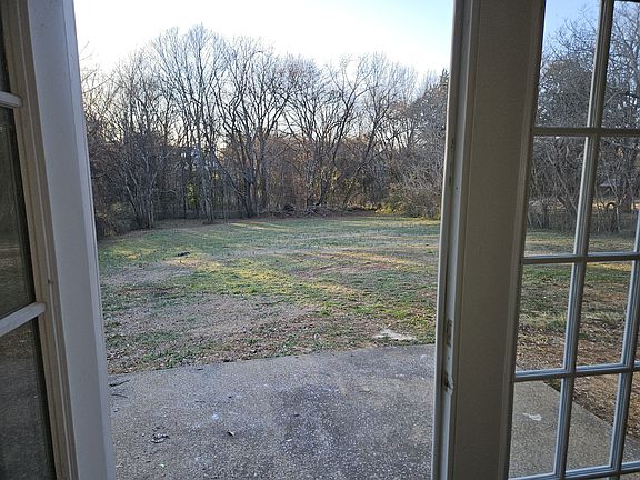 Double doors going into the large backyard
