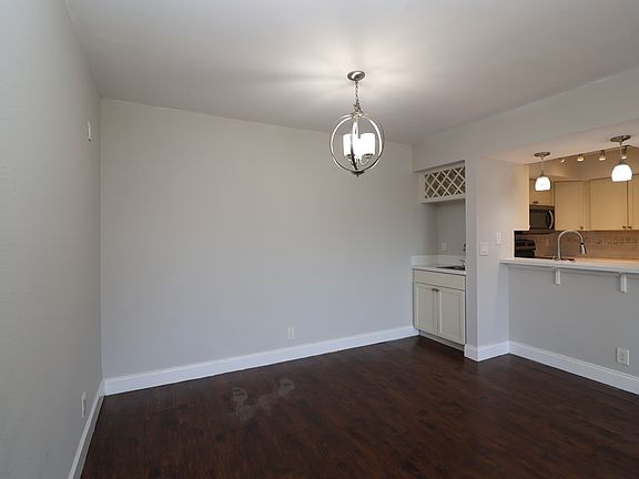 Dining area, wine rack and kitchen pass-thru