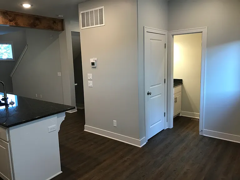 You can see powder bath here. Pantry is door to the left