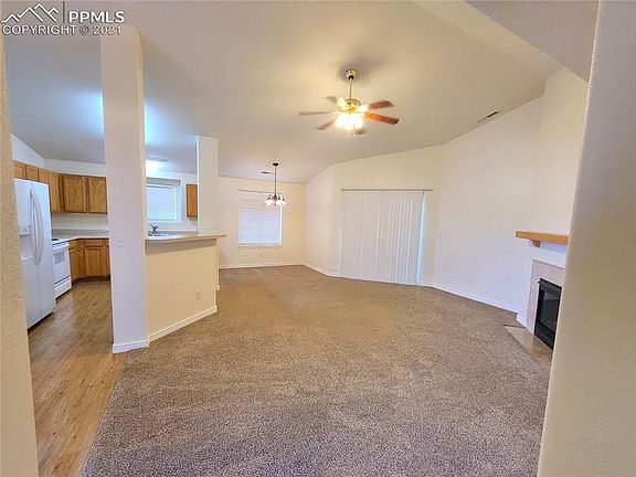 Living room opens to private balcony.