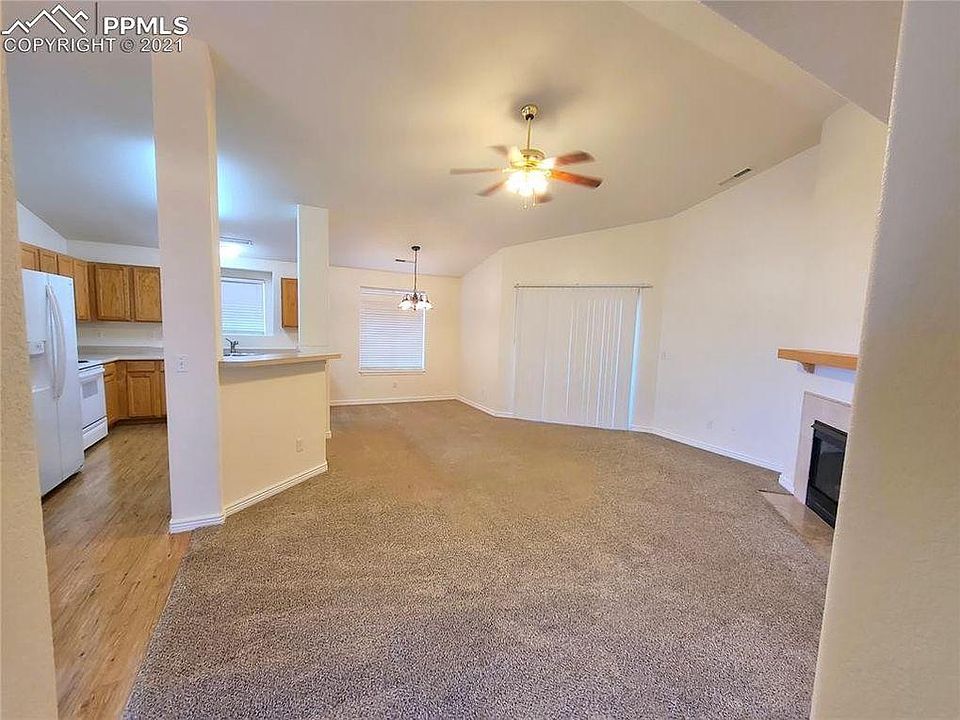 Living room opens to private balcony.