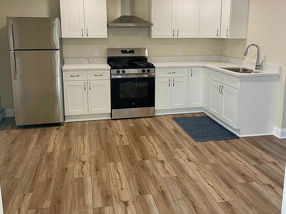 Kitchen with new appliances, cabinets, and quartz countertops