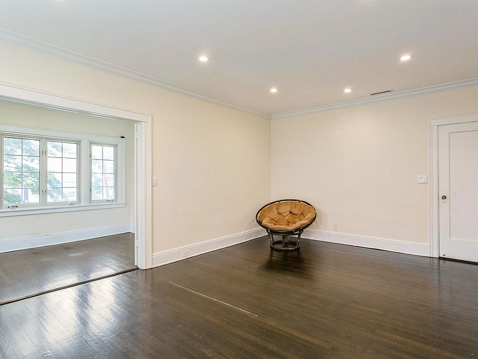 Living room with another view and the convenient additional windowed room suitable as a den or office.