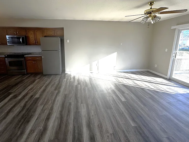 FROM HALLWAY LOOKING AT KITCHEN AND LIVING ROOM