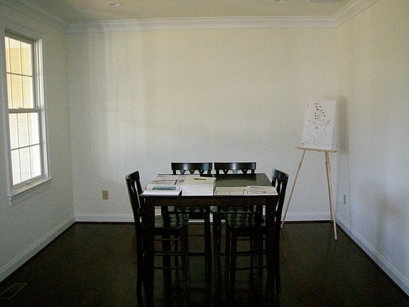 Office with lots of light and french doors off foyer.