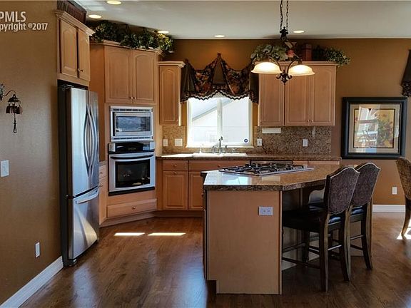 Kitchen with stainless steel appliances and gas cook top.