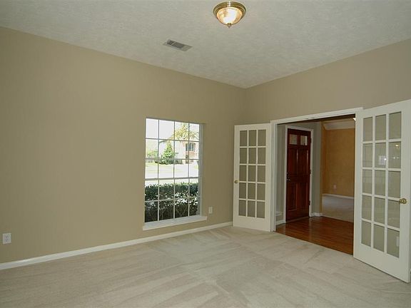 The foyer opens to tile flooring and a nice greeting area. French doors off the foyer lead into a ve