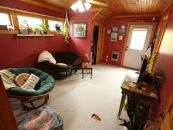Living Room **Note - Carpet has been replaced by wood grain vinyl flooring in next photo.