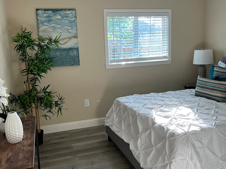 Bedroom shown with simulated furniture