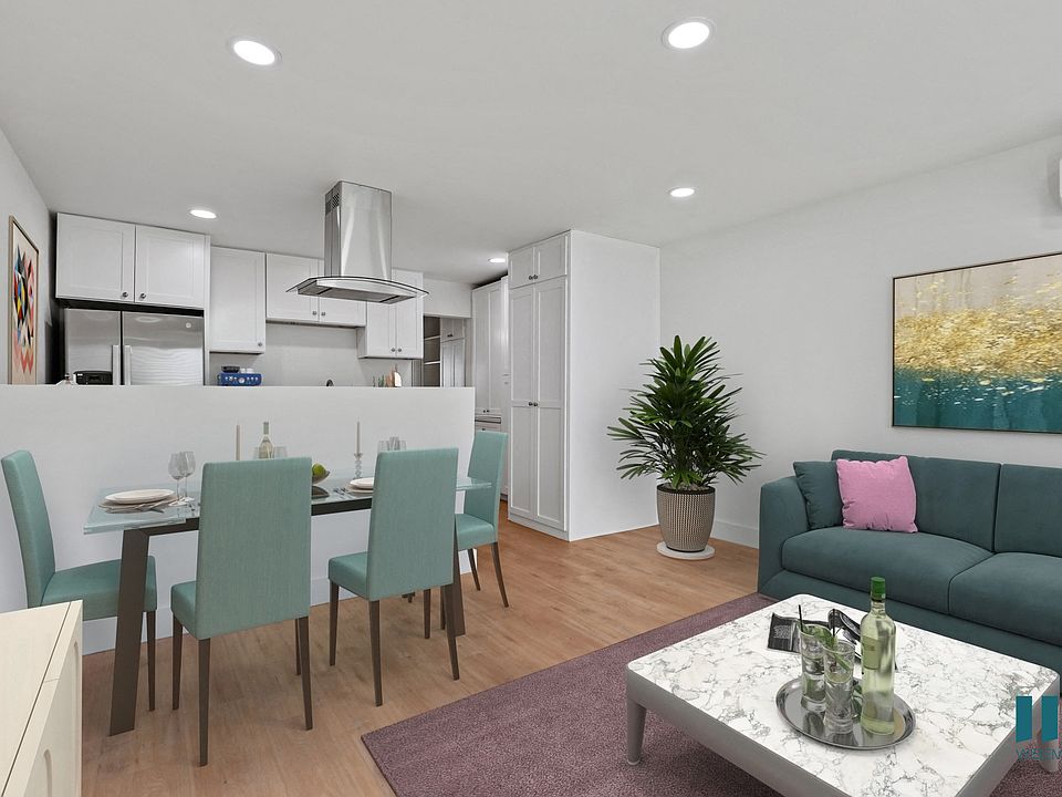 Open-Concept Kitchen, Dining, and Living Room with Vinyl Flooring and Recessed Lighting
