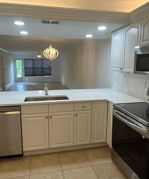 Kitchen view towards dining room and living room.