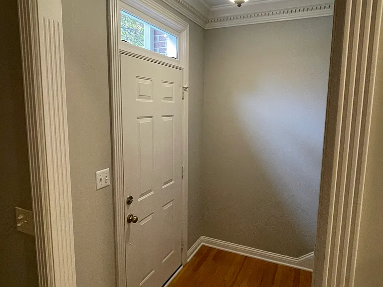 Entry with transom window and hardwood floor