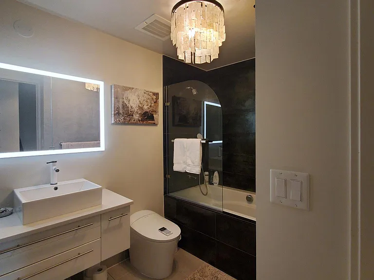 Remodeled bathroom with soaking tub and bidet