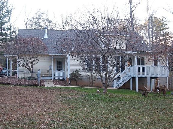 View of portion of the back of the house from the back yard (creek on rt.)