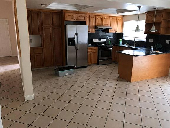 Kitchen, half bathroom along the hallway