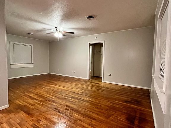 living room and entry to 2 bedrooms and 2nd restroom