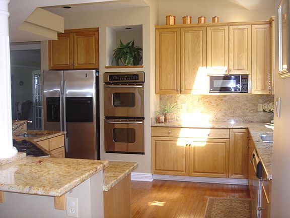 New refrigerator and double oven, 2 dishwashers, 5 burner gas range in kitchen