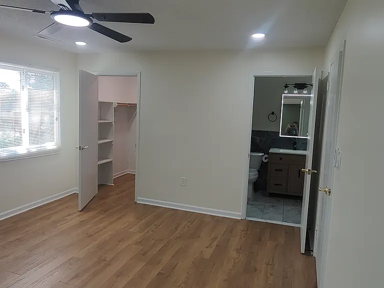 Inside of master bed. Walking closet on the left. And attached full bath on the right.