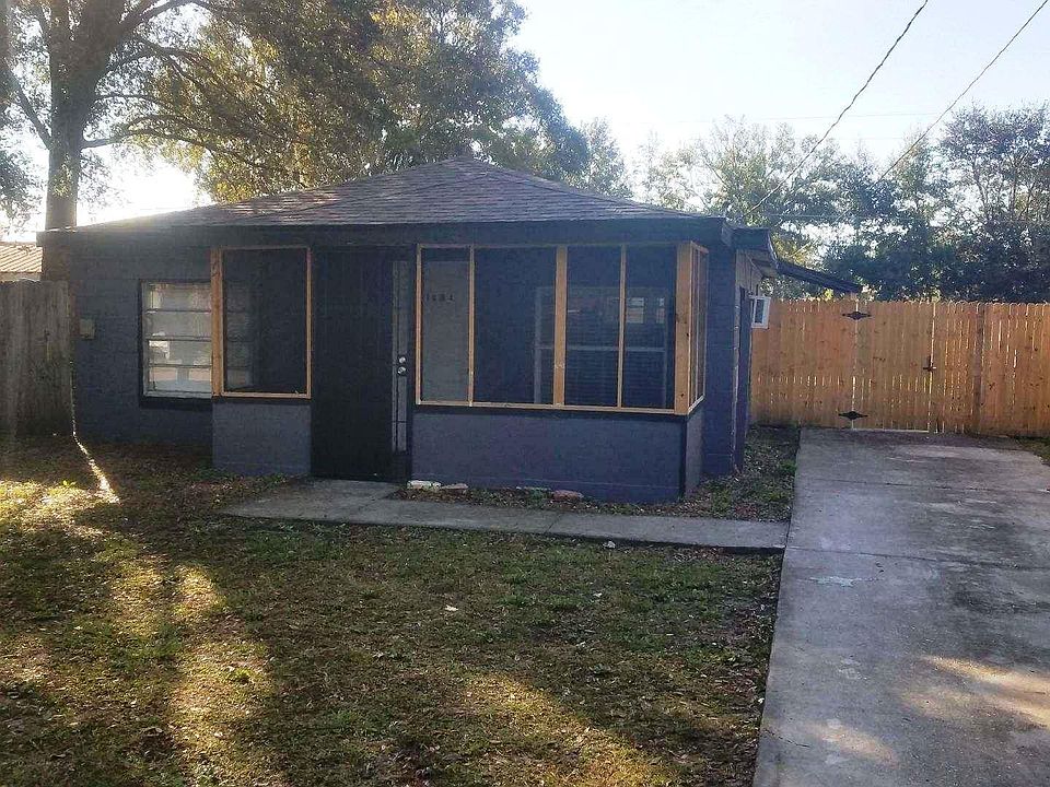 RECENTLY REMODELED AND FRESH PAINT ON INTERIOR AND EXTERIOR high wood fence all around the property with 2 lockable access gates great for parking boat, cars, trailer