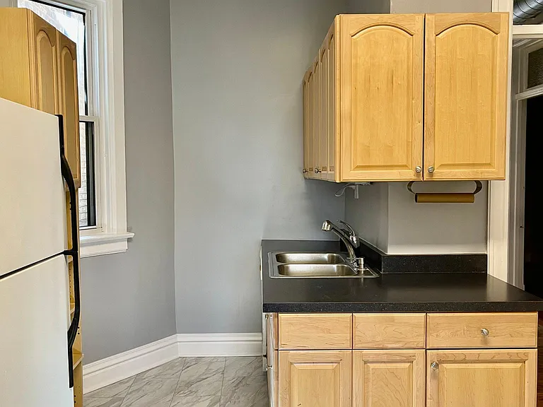 Sink and countertop in dishwashing area.