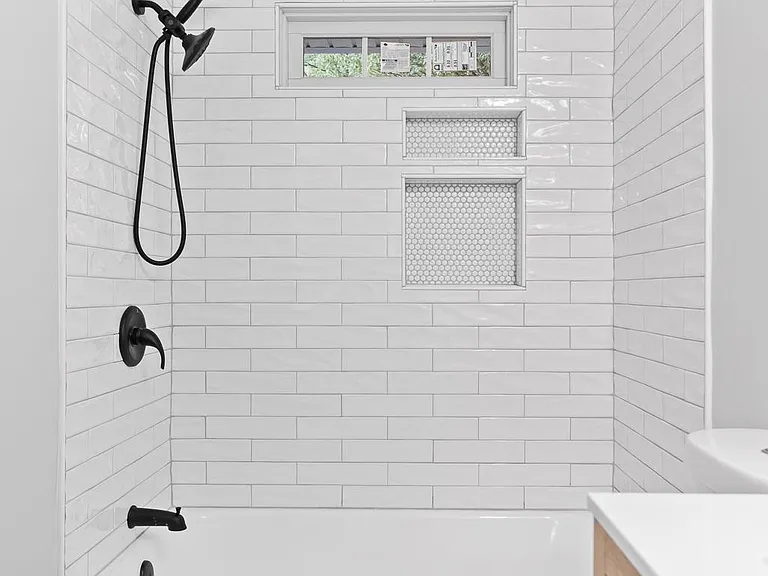 Hall Bath - great shower/rub combo with floor to ceiling tile and new fixtures