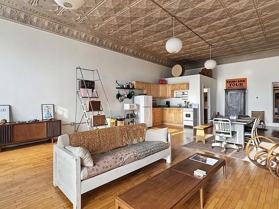 Tin ceilings. View of kitchen area from Living room area.
