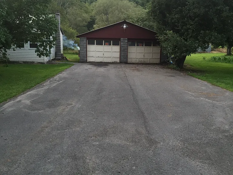 Driveway to garage, door will be replaced in July with electric openers