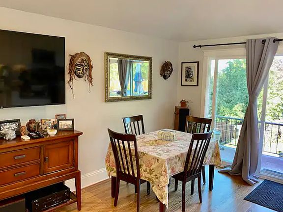 Kitchen has lots of light and opens to the deck outside.