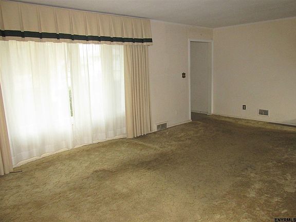 Carpet over wood floor.