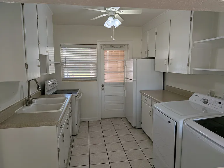 The kitchen is bright and has an efficient layout. Note: no dishwasher, no garbage disposal. Bring your own microwave.