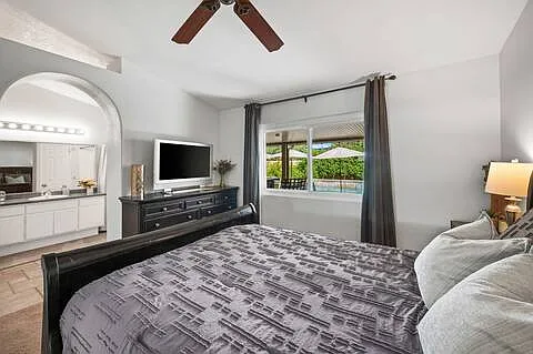 Master Bedroom photo displays a Queen size bed. Includes walk in closet, bathroom and walk in shower