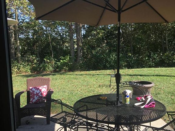 Backs to wooded area and Veterans Park walking path....