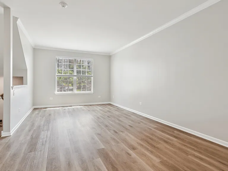 Davey Two Bedroom Townhome - large living room with rich wood flooring